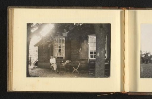 Man on a Terrace in Front of a House