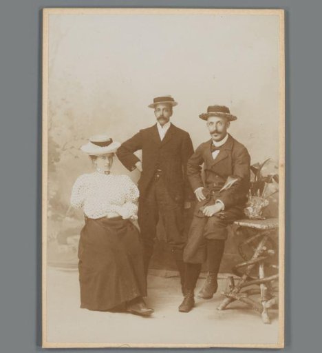 Group portrait of two unknown men and a woman