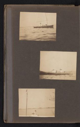 Three people in a sailing boat on a lake