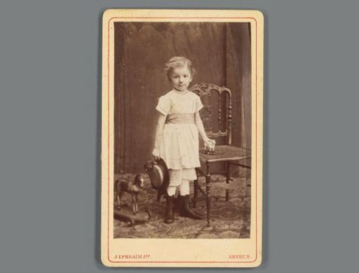 Portrait of an unknown girl with toys from the family and circle of Eugene van Delden and Belle van Delden-Denninghof Stelling