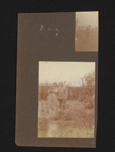 Walking man, seen from behind, and portrait of two people in a garden with a cat in their arms