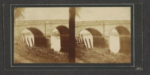 Bridge with a grassy bank in the foreground
