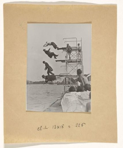 Snapshot of four people diving from a diving board into a lake (with solarization)