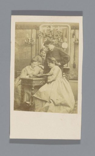 Group at a table with an album