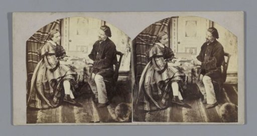 Man and woman seated in an interior