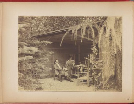 Gerard Aalbersberg and Hedwig and Jan Kleintjes reading under the veranda