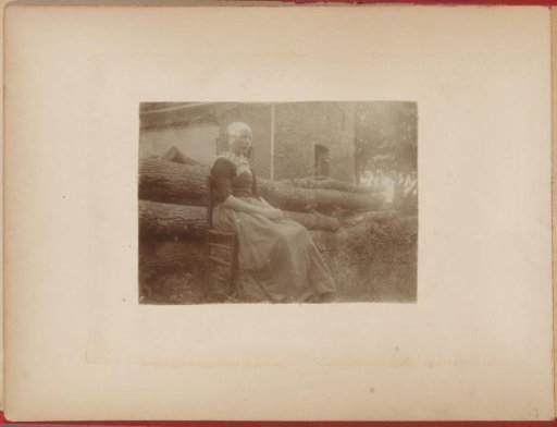 Hendrikje Sitting on a Chair Outdoors