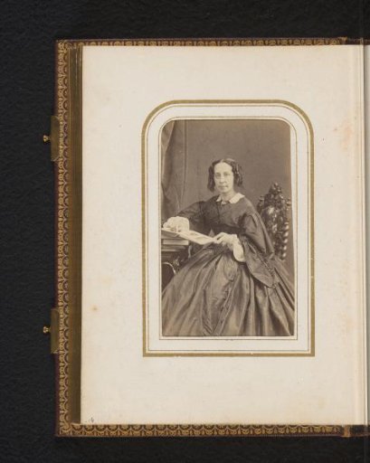 Portrait of an Unknown Woman with an Album
