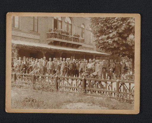 Group Portrait with Machiel G. G. Suyver and a Large Group of Unknown Men in the Garden of a Lodging House