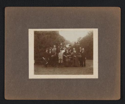 Group Portrait with Fourteen Unknown Persons with Festive Attributes, Possibly Including Machiel G. G. Suyver