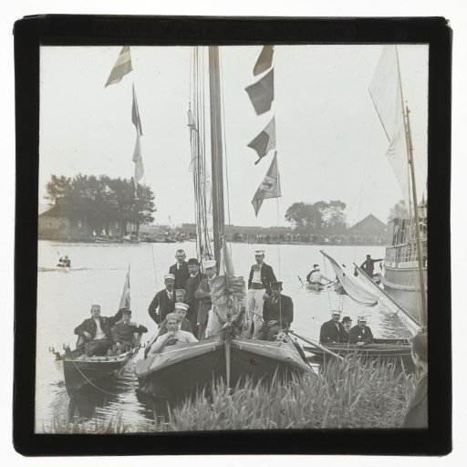 Sailing boat and various rowing boats with members of the rowing club Willem III in Haarlem