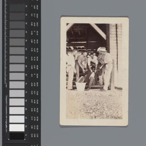 Five white men molesting a black man