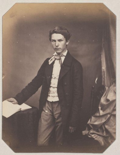 Portrait of an Unknown Standing Young Man with Hand on Book