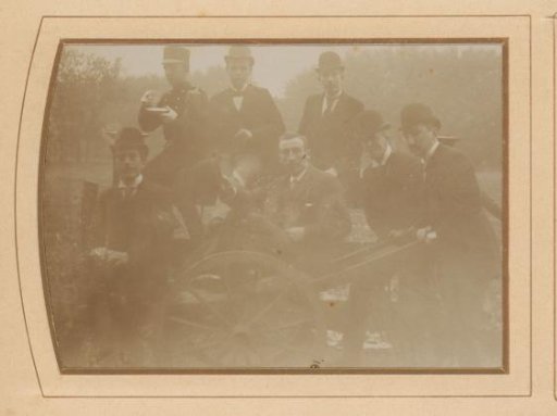 Students Around a Wooden Handcart, with François Buys Behind the Cart on the Right