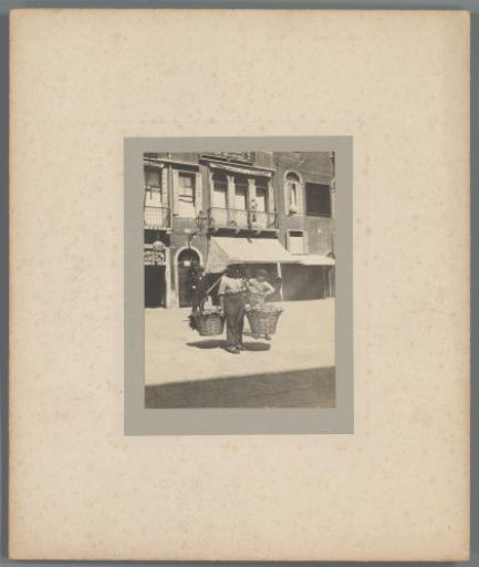 Man with baskets of peaches on the street, Venice