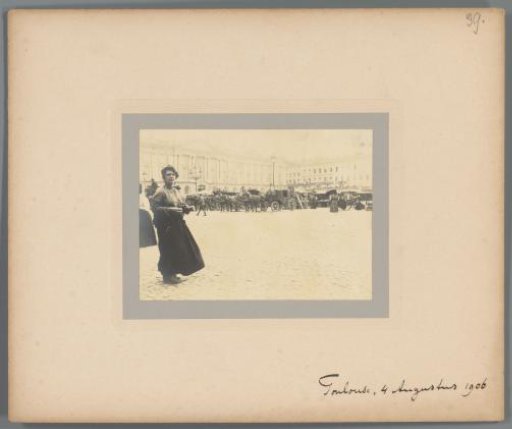 Woman on a square with carriages, Toulouse