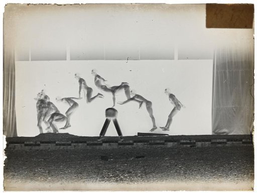 Man taking the pommel horse and sprinting forward with arms spread