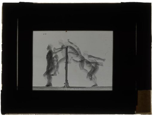 Man Jumping Over a Bar