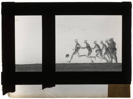 Man holding the ball in his hand and receiving it on his foot