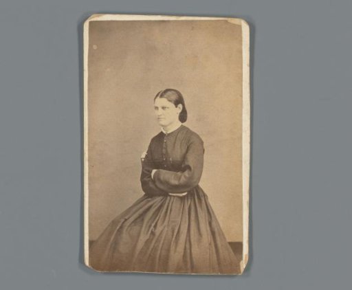 Advertisement for the wholesale business of Whitemore, Carter & Brown in Chicago with a portrait of an unknown woman