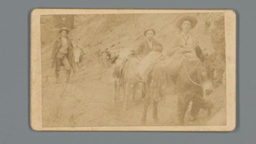 Three men with donkeys on a mountain path in Manitou Springs, Colorado, as advertisement for rental company 'The Burro Brigade' by Hutchinson & Larson