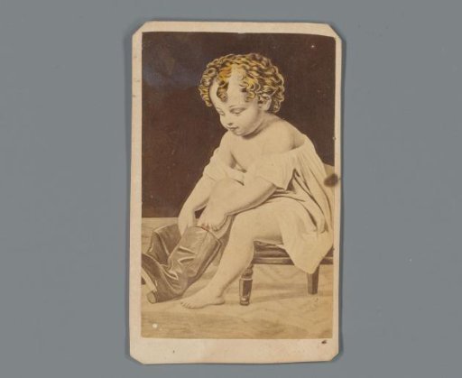Photographic reproduction of a drawing of a child putting on a boot as advertisement for clothing store Pierson & Hews in New Orleans, Louisiana
