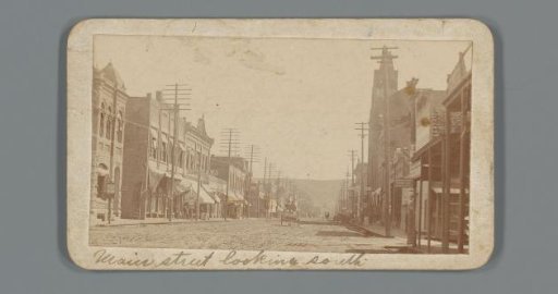 View of Main Street in Colfax, advertisement for Hotel 10 SC
