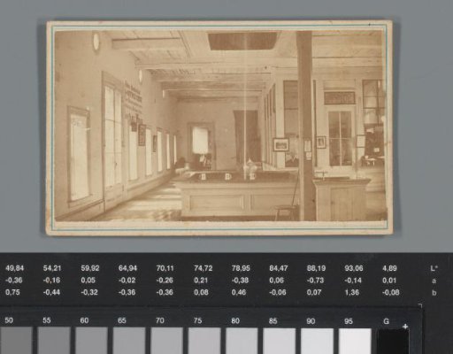 Advertisement for bottled water from Saratoga Springs with a view of an office interior