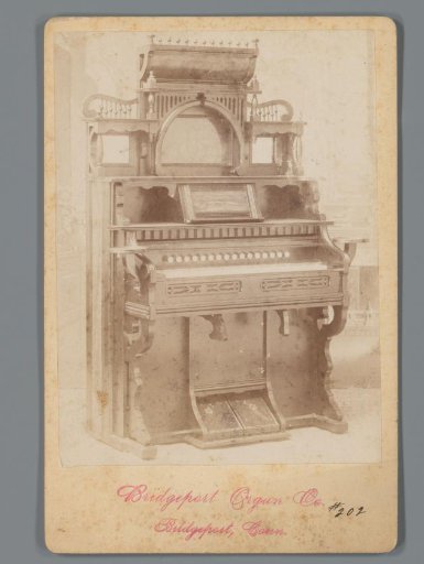 Advertisement featuring a photographic reproduction of an organ by the Bridgeport Organ Co.