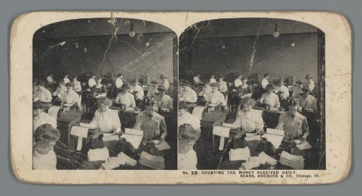View of female employees counting the day's money for Sears, Roebuck & Co.