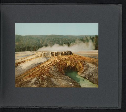 View of a steaming hot spring in Yellowstone National Park, named the Punch Bowl