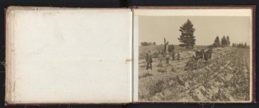 Farmers and a man in hat and suit on the land with an agricultural implement of the Eureka Mower Co. in Utica