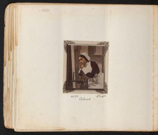 Portrait of an unknown young woman leaning on a spinning wheel