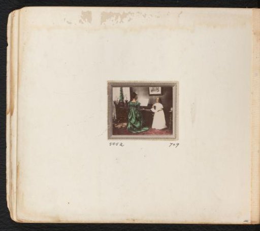 Woman playing a piano next to a girl