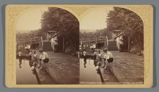 Boys with feet in the water at Crosbyside Dock, Lake George