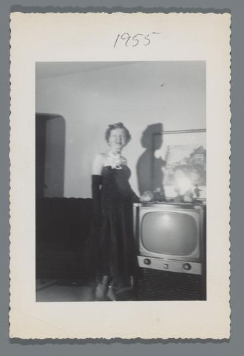 Woman by a television