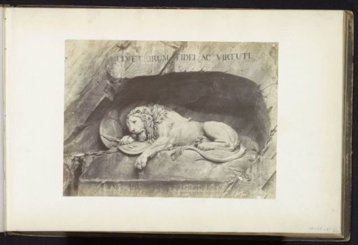Lion Monument in Lucerne with the inscription 'Helvetiorum Fidei ac Virtuti' carved into the rock