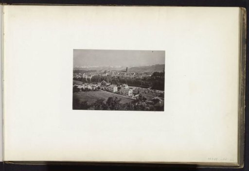 View of a town and mountains, probably in the Alps