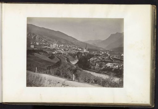 Valley with village and church, presumably in the Alps