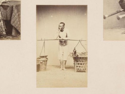 Portrait of an Indonesian man standing by a carrying pole