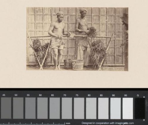 Portrait of two Indonesian laborers, possibly painters