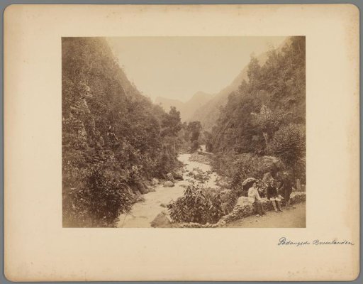 View of a river in West-Sumatra, with three people in the lower right