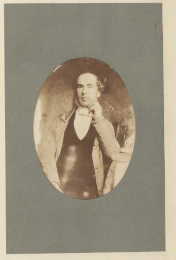 Self-portrait, leaning on a table, with the statuette 'Ariadne on the Panther'