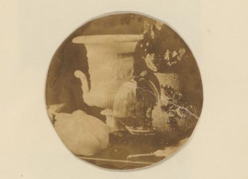 Still life with Meissen 'Snowball Vase' and ship model