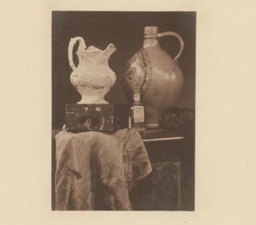 Still life with an English cream jug, Westerwald jug and a bottle of Acetic Acid