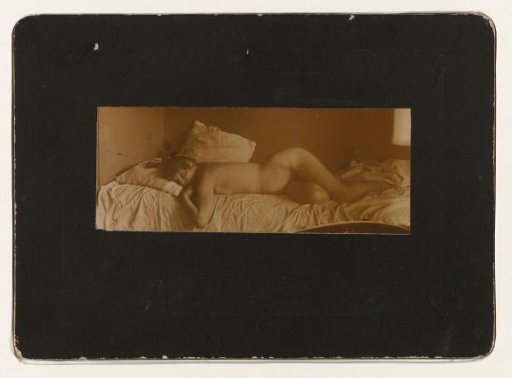 Marie Jordan lying naked on a bed