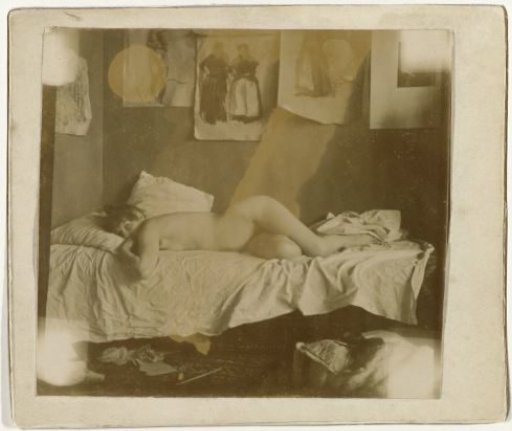 Marie Jordan lying naked on a bed