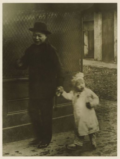 Man with child on street in Chinatown, San Francisco