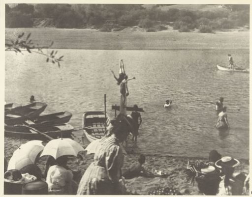 People bathing and sunbathing in a river, California