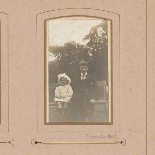Portrait of a man and a girl on a bench in a park